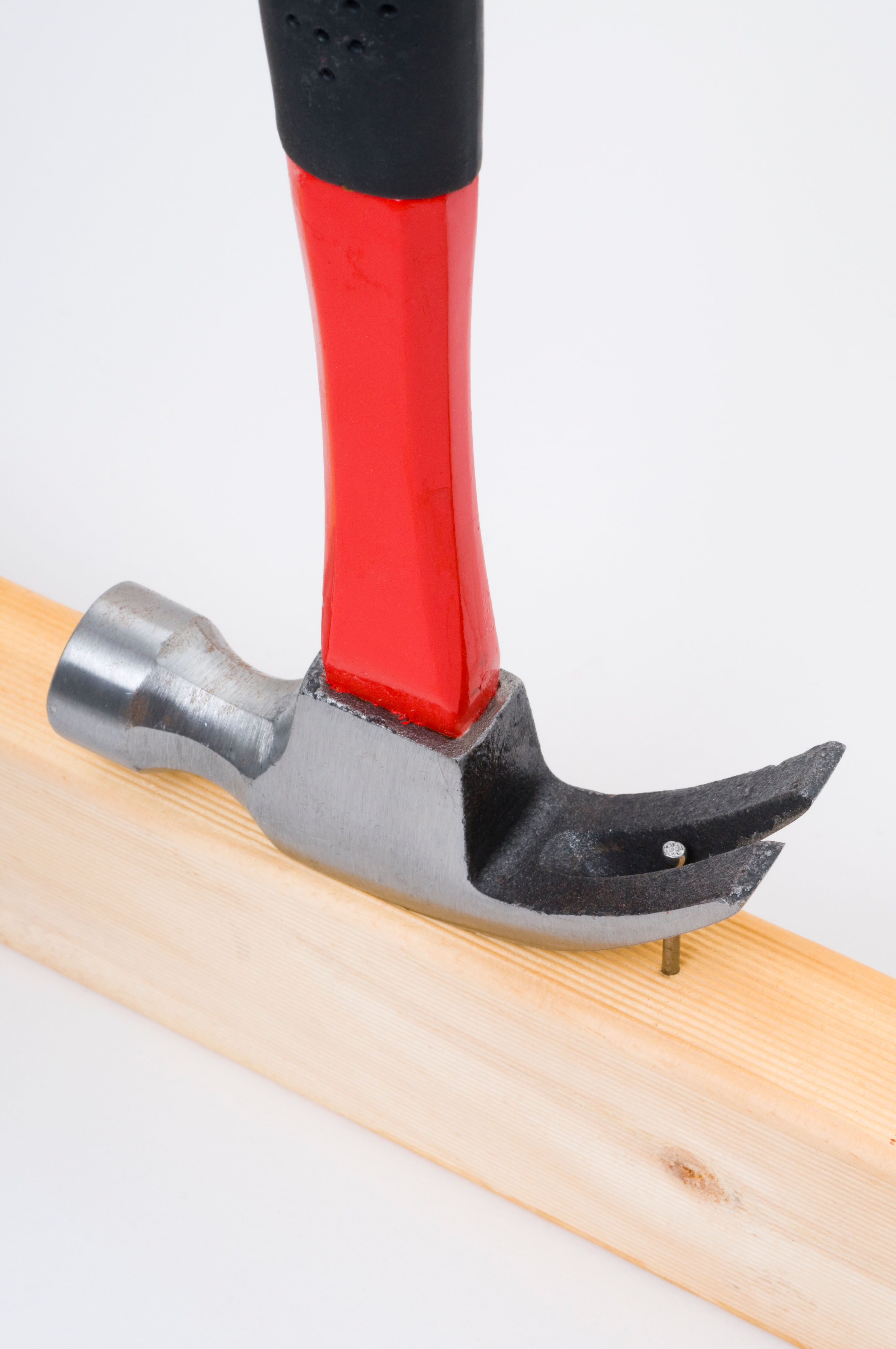 Hammer pulling a nail — leverage